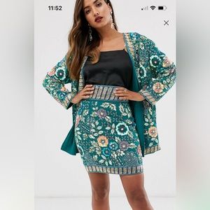 All embellished jacket with matching skirt.